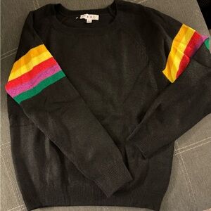 Black sweater with striped accents on sleeves